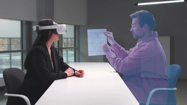 Asian woman in VR glasses in cyberspace of metaverse at business meeting