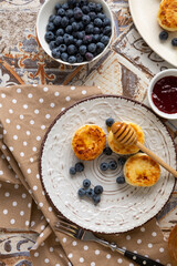 Top view of fresh cheeese pancake fritters breakfast food berries
