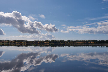 Funen / Denmark: Cloudscape reflected in Lake Noret near Boejden