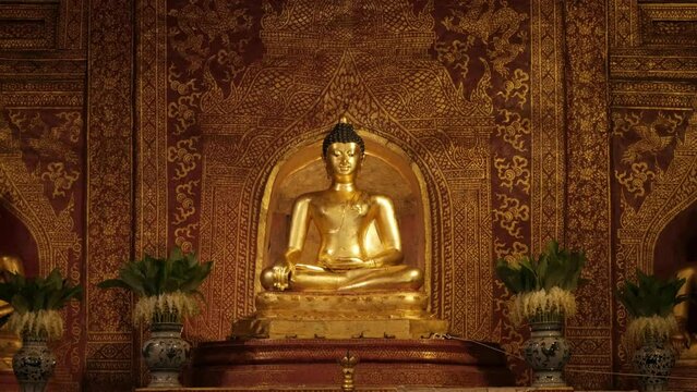 beautiful golden budha statue of Phra Singha inside Wat Phra Singha temple. Southeast asia life in Chiang Mai,Thailand.