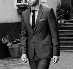 Gray business suit with tie
