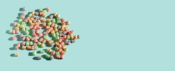 The background or texture of a colorful mini marshmallow. The concept of winter food. Copy space