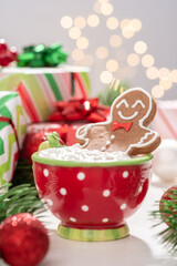 Gingerbread cookie man with a hot chocolate for Christmas. Traditional holiday symbol. Christmas holiday background.