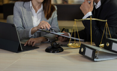 Concepts of Law and Legal services. Lawyer working at office.	