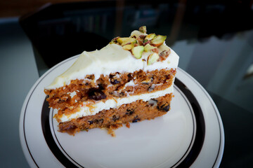 carrot and raisin cake with pistachio topping , carrot cake