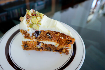 carrot and raisin cake with pistachio topping , carrot cake