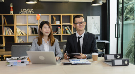 Person analyzing figures, Two businessman working on tablet and new startup marketing idea presentation, Business meeting discussion startup concept.