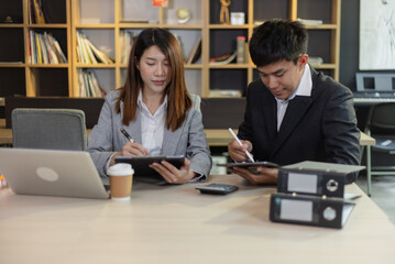 Person analyzing figures, Two businessman working on tablet and new startup marketing idea presentation, Business meeting discussion startup concept.	
