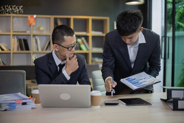 Technology and financial advisory services concert. Business teamwork and working on digital laptop computer with advisor showing plan of investment to clients at table office. Digital marketing.