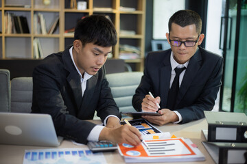Technology and financial advisory services concert. Business teamwork and working on digital laptop computer with advisor showing plan of investment to clients at table office. Digital marketing.