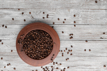 Background coffee beans in a plate on a white table