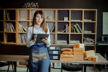 young businesswoman using camera live streaming online chat with packaging box, Business online influencer on social media concept, Online Selling, Online Shopping to market.