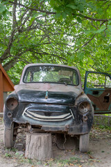 old rusty pink passenger car