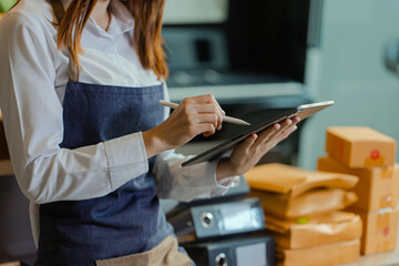 Young asian woman and online selling at home office, Startup small business owner working Online...