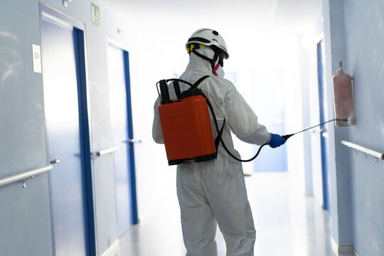 One firefighter disinfecting the interior of a building