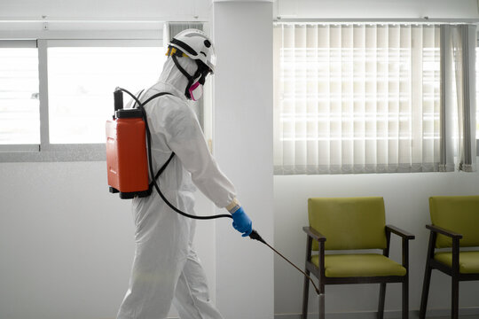 One firefighter disinfecting the interior of a building