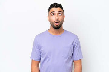 Young Arab handsome man isolated on white background looking up and with surprised expression