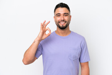 Fototapeta premium Young Arab handsome man isolated on white background showing ok sign with fingers