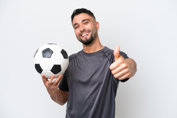 Arab young football player man isolated on white background with thumbs up because something good...