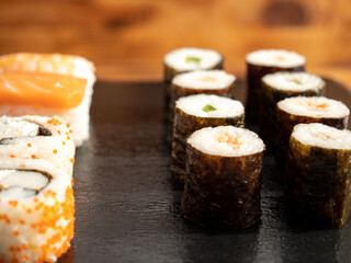 Japanese kitchen. Sushi on a dark background.