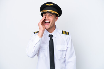 Airplane caucasian pilot isolated on white background shouting with mouth wide open