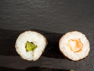 Japanese kitchen. Sushi on a dark background.