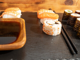 Japanese kitchen. Sushi on a dark background.