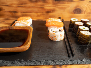 Japanese kitchen. Sushi on a dark background.