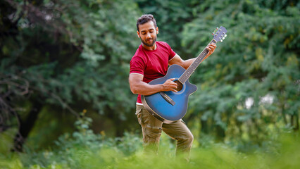 Indian boy playing guitar image