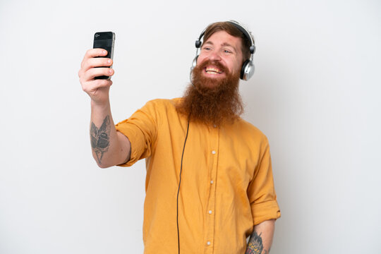 Telemarketer man isolated on white background making a selfie