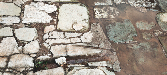 Texture floor path asphalt street parking background iron rock granite water puddle clay gravel cobblestone portuguese stone cement manhole cover outlet energy gas sewer electric fire city urban tile