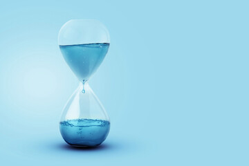 Time as water, a concept. Water with a drip dripping in a glass clock. Creative idea, save the...