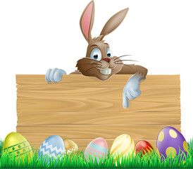 Bunny character pointing and Easter eggs