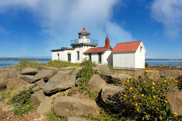 West Point Light House  also known as the Discovery Park Lighthouse on a sunny day. The lighthouse is an active aid to navigation on Seattle, Washington's West Point.