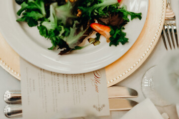 salad on plate and charger