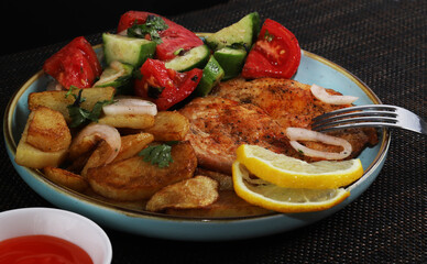 Langet, chop with vegetables on the sides. Shallow depth of field