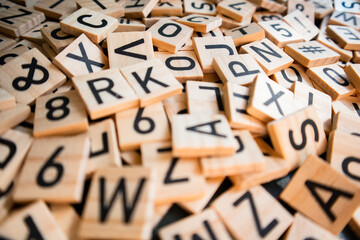 Wooden cubes laid out on the school blackboard with the text selective focus