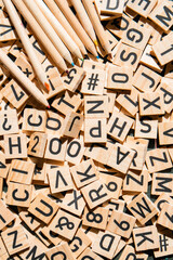 Wooden cubes laid out on the school blackboard with the text selective focus