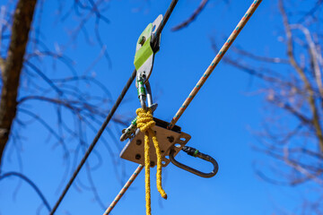 The system for fastening insurance with carabiners in tourism and mountaineering. Background with copy space