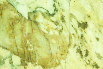 Yellow marble stone with veins textured background