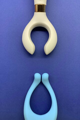 Two sex toys. Vibrators for blue background. Clitoral vibrators useful for sex shop or adults