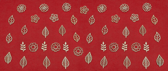 laser carved wood decoration on red paper background