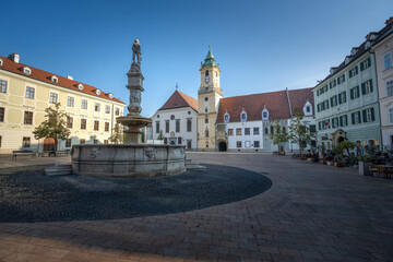 Fototapeta na wymiar Main Square with Old Town Hall, Maximilian Fountain (or Roland’s Fountain) and Jesuit Church - Bratislava, Slovakia