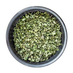 Dried thyme in metal bowl on transparent background. Overhead shot.