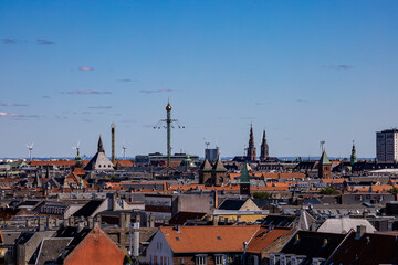 Fototapeta na wymiar Copenhagen, Denmark, The city skyline on a sunny day and Tivoli Gardens in the distance.