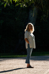 Copenhagen, Denmark, A woman stands in the   Frederiksberg Gardens