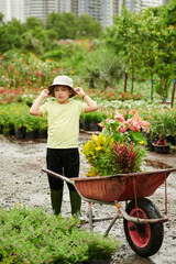 Boy Working at Flower Nursery