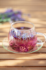 Glass cup of lavender tea.