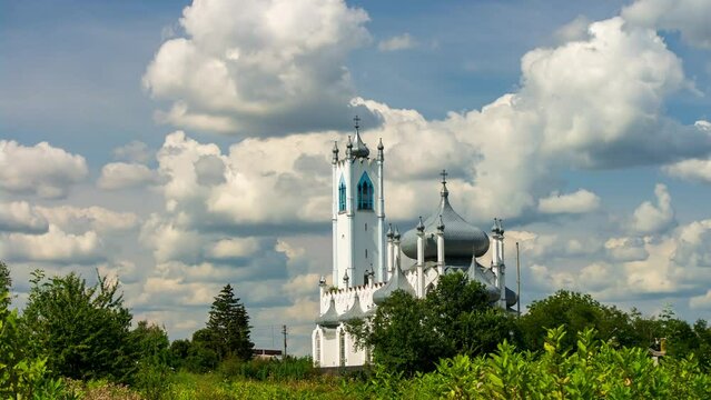 Quick motion of fluffy clouds over Saviour's Transfiguration Church in Moshny village, Cherkasy region, Ukraine. 4K Time Lapse