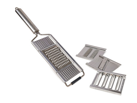 Multifunctional grater for vegetables and fruits with interchangeable blades isolated on white background